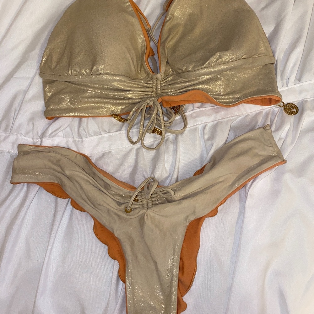Reversible Luli Fama bikini with gold sparkles from everything but water